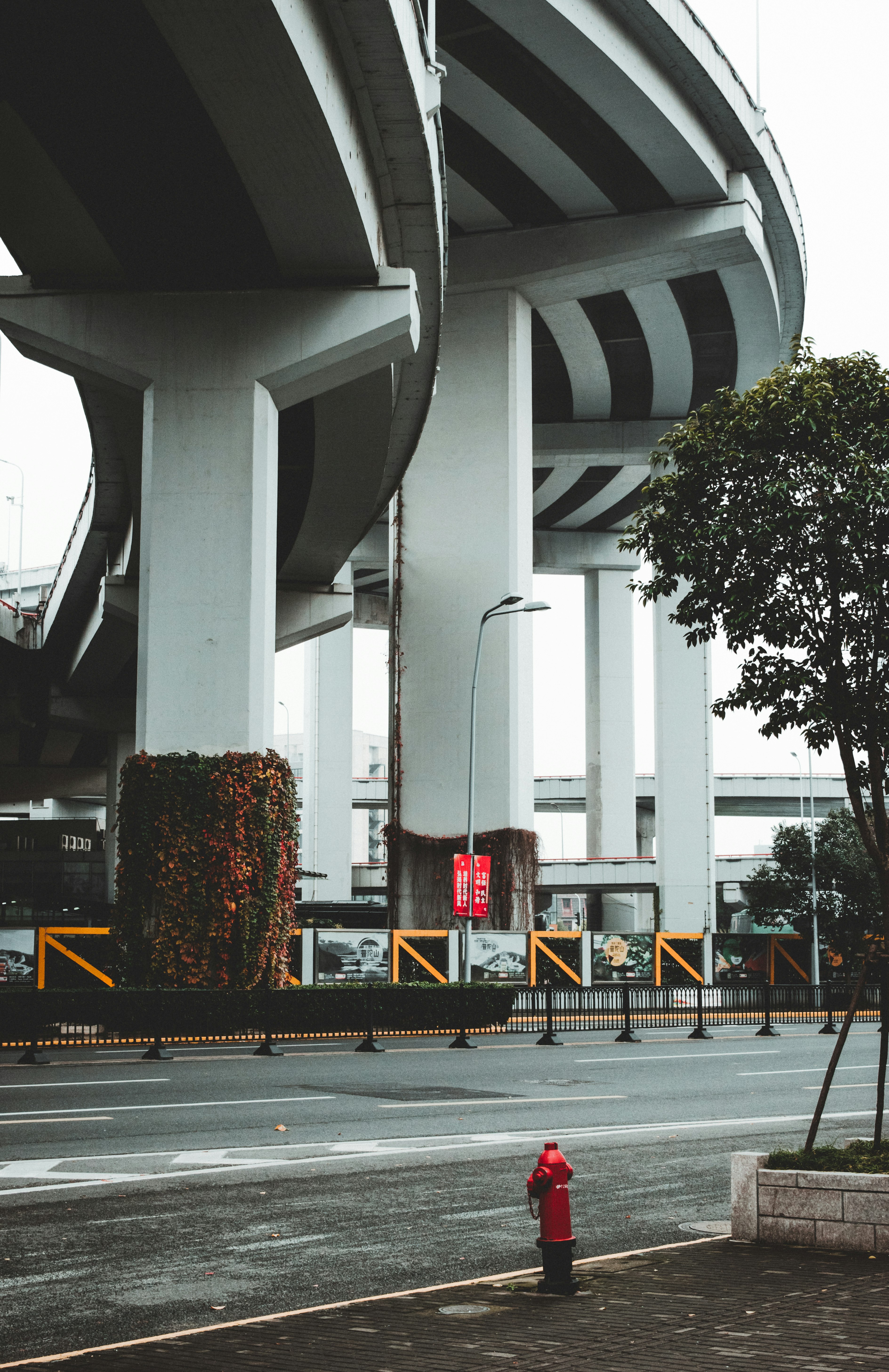 white and gray concrete building near green trees during daytime